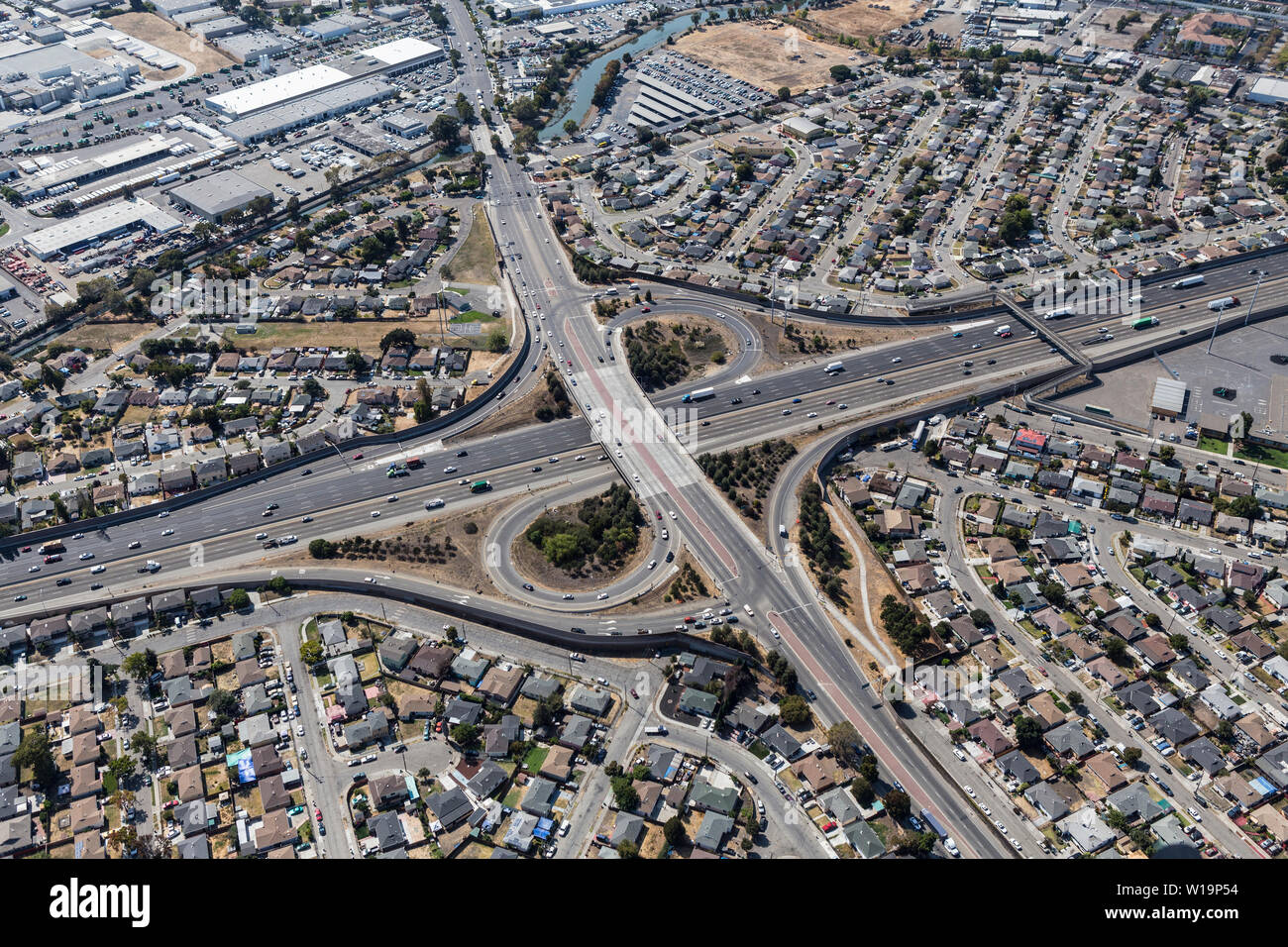 Aerial view of streets, buildings and traffic along the 880 freeway at 98the Ave in Oakland California. Stock Photo