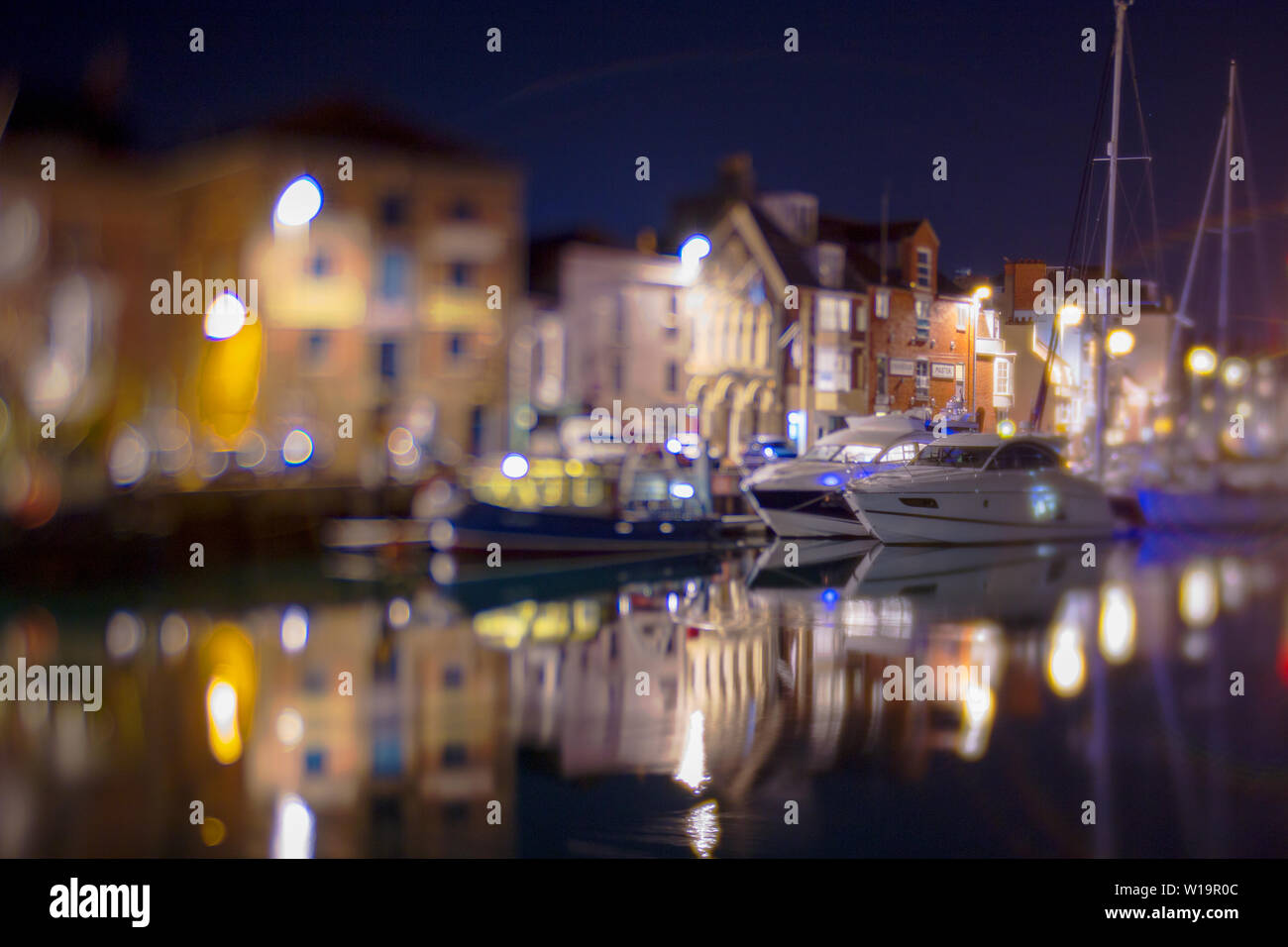 A nighttime view of Weymouth Harbour in Dorset on the South Coast of England Stock Photo