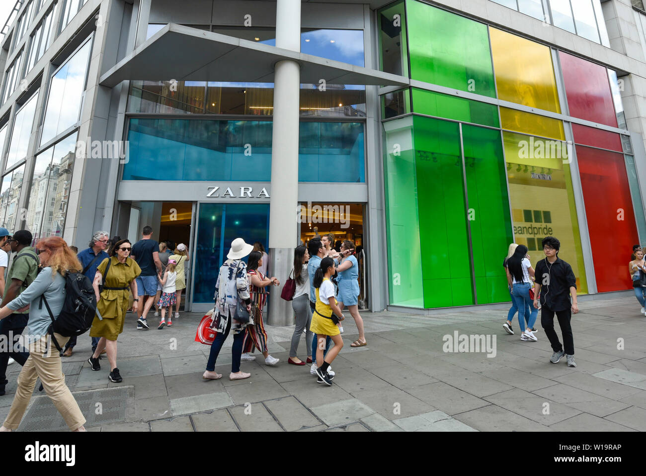 London, UK. 1 July 2019. A Zara store in Oxford Street is one of many  stores in the capital's West End whose exteriors are decorated in rainbow  colours in support of Pride