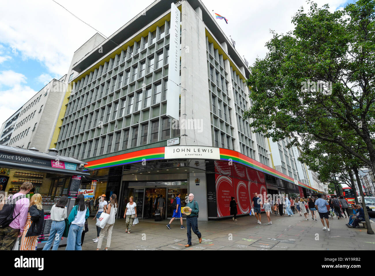London, UK. 1 July 2019. The John Lewis department store in Oxford Street  is one of many stores in the capital's West End whose exteriors are  decorated in rainbow colours in support