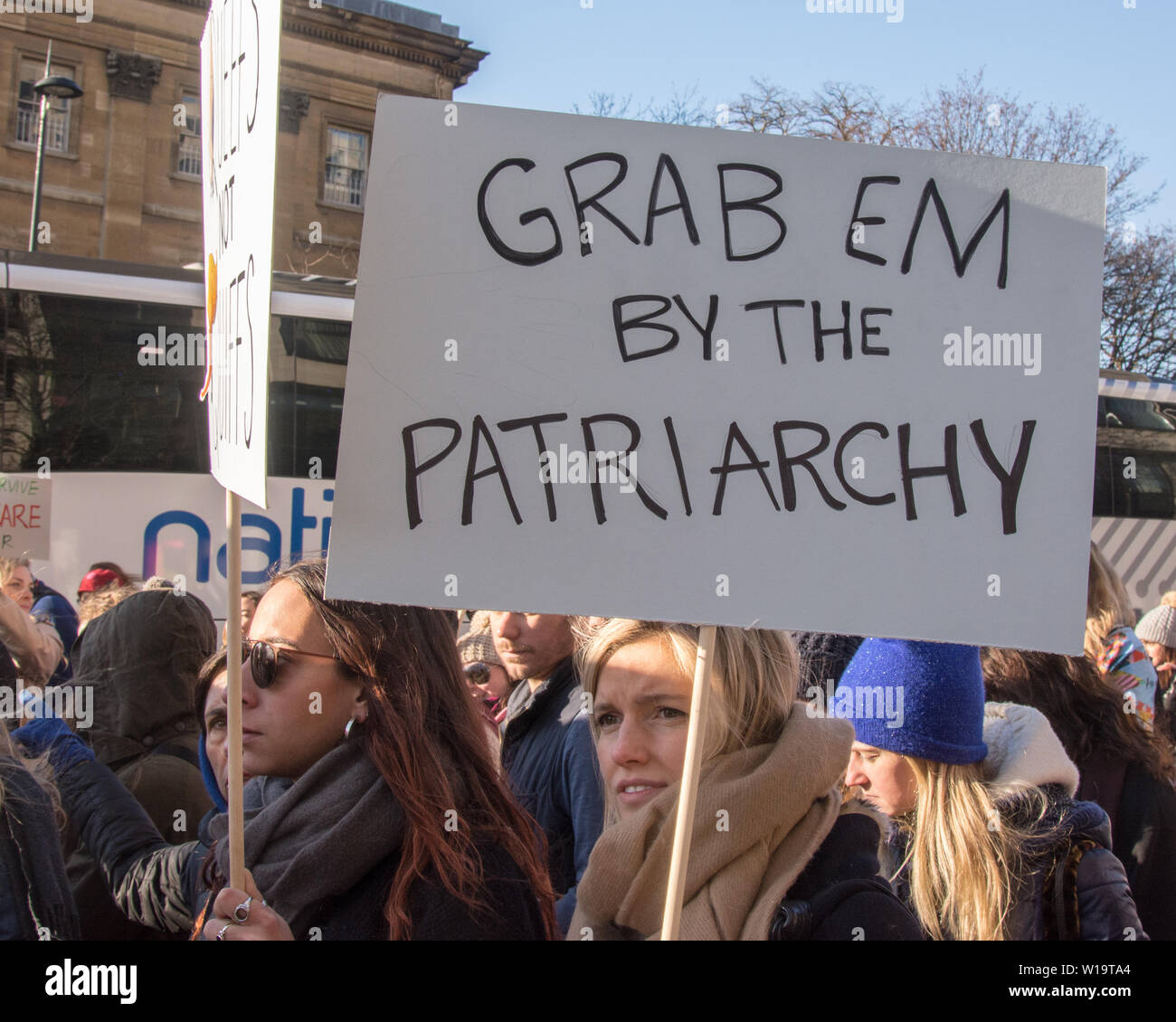 Women's March, London, UK, 21st January 2017. A woman carries a placard reading 'grab 'em by the patriarchy' during London's Women's march, the day after the inauguration of President Donald Trump. Up to 10,000 took part in London as women worldwide marked the day by marching in an act of international solidarity. Many carried placards referencing statements made by Donald Trump, considered by many as anti-women or otherwise offensive. Stock Photo