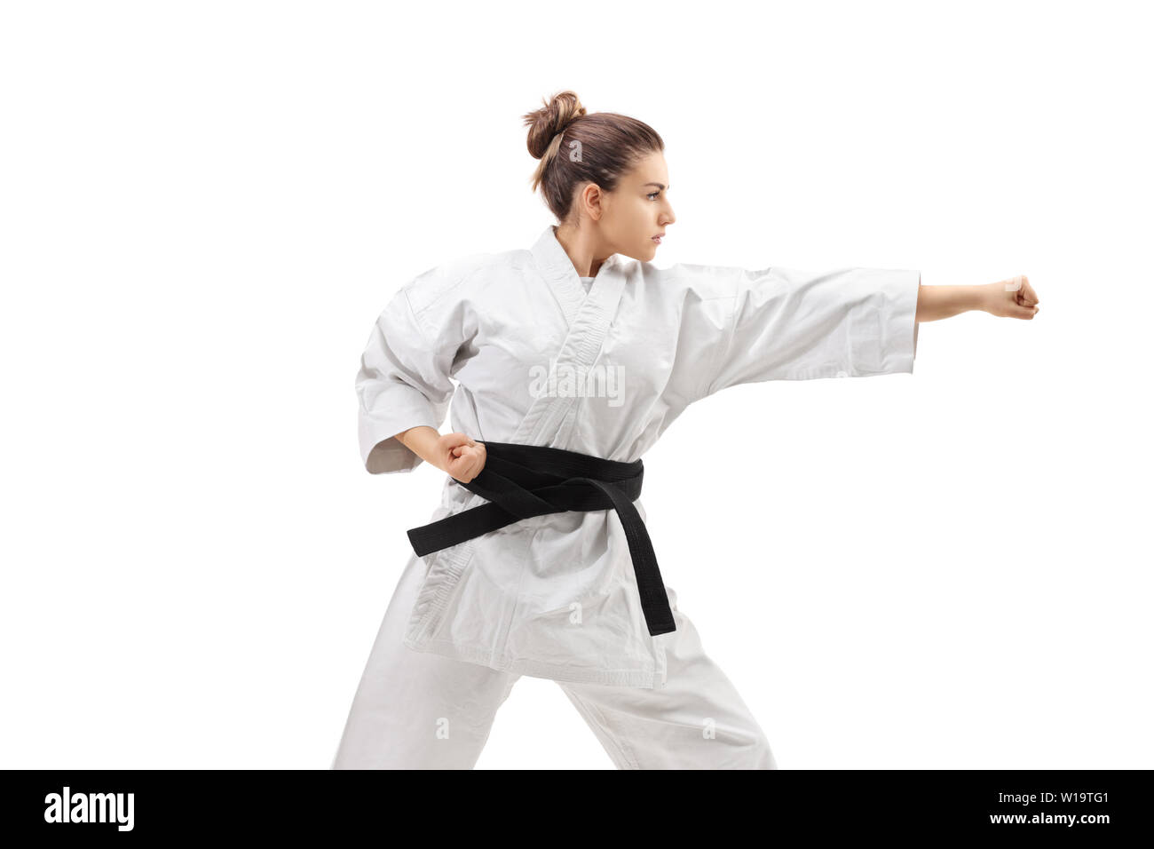 Female practicing karate isolated on white background Stock Photo