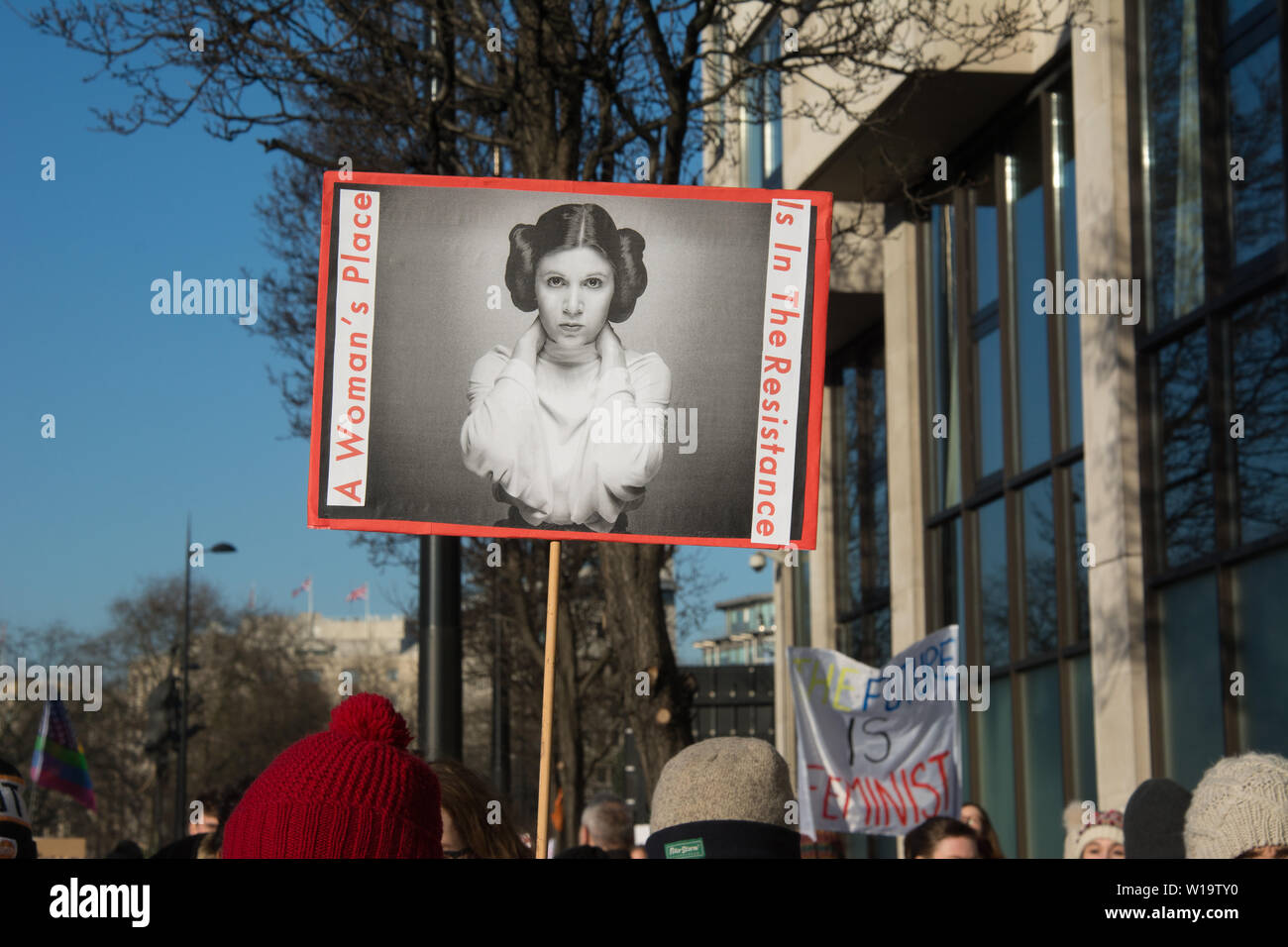Women's March, London, UK, 21st January 2017. A placard showing Princess Leia and reading 'A woman's place is in the resistance'  is carried as people take to the streets in London for the Wonen's march, to protest the day after the inauguration of President Donald Trump. Up to 10,000 took part in London as women worldwide marked the day by marching in an act of international solidarity. Many carried placards referencing statements made by Donald Trump, considered by many as anti-women or otherwise offensive. Stock Photo