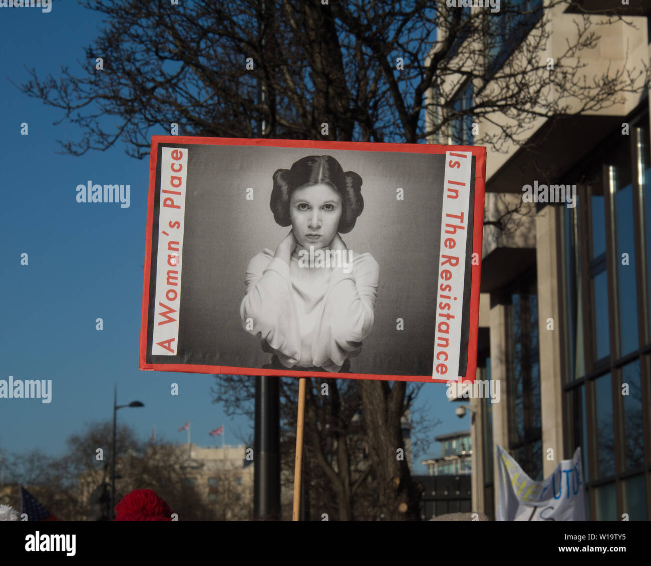 A placard showing Princess Leia and reading 'A woman's place is in the resistance' carried during the Women's march in London, January 2017 Stock Photo