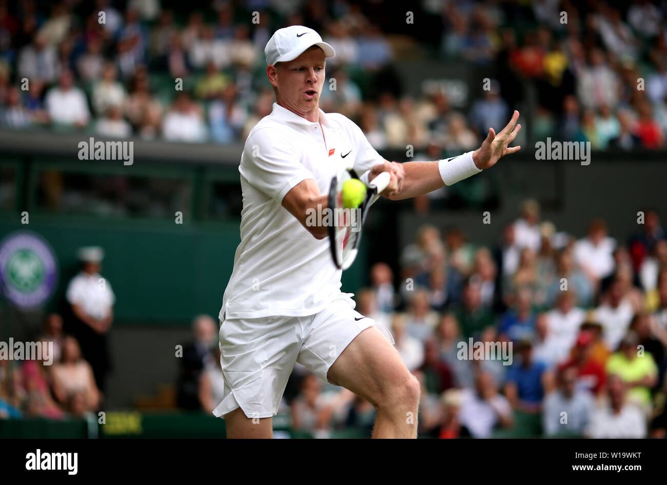 Kyle Edmund in action against Jaume Munar on day one of the Wimbledon Championships at the All England Lawn Tennis and Croquet Club, Wimbledon. Stock Photo