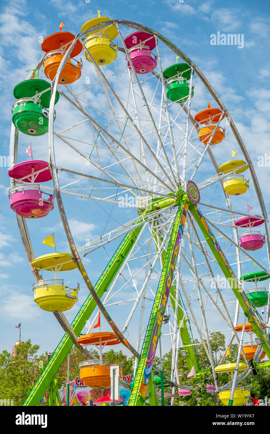 A colorful Ferris Wheel amusement ride in Traverse City, Michigan , part of the National Cherry Festival celebration . Stock Photo