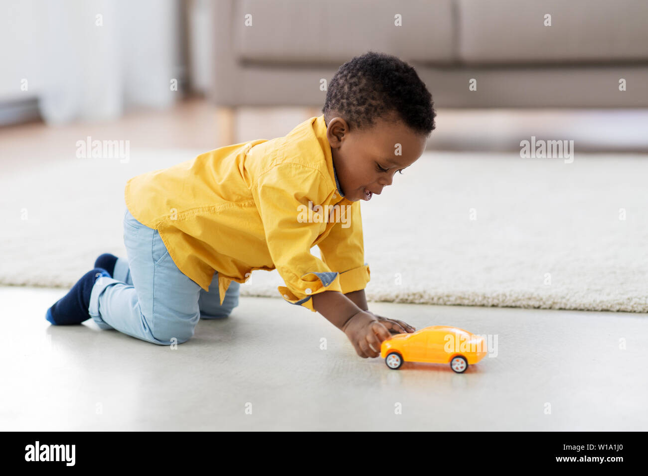 african american baby boy playing with toy car Stock Photo Alamy