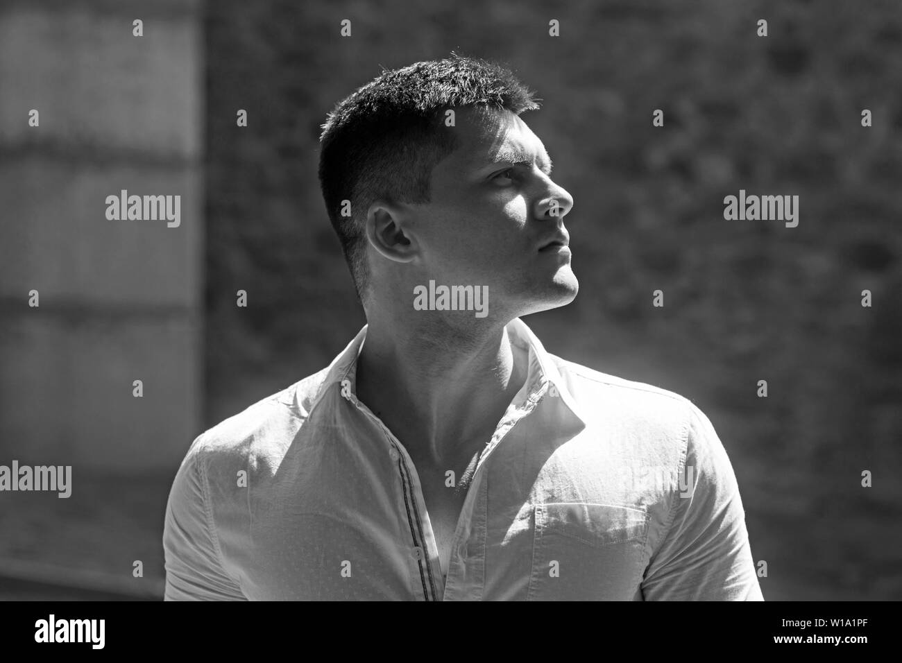Handsome caucasian man standing on Black and White Stock Photos ...