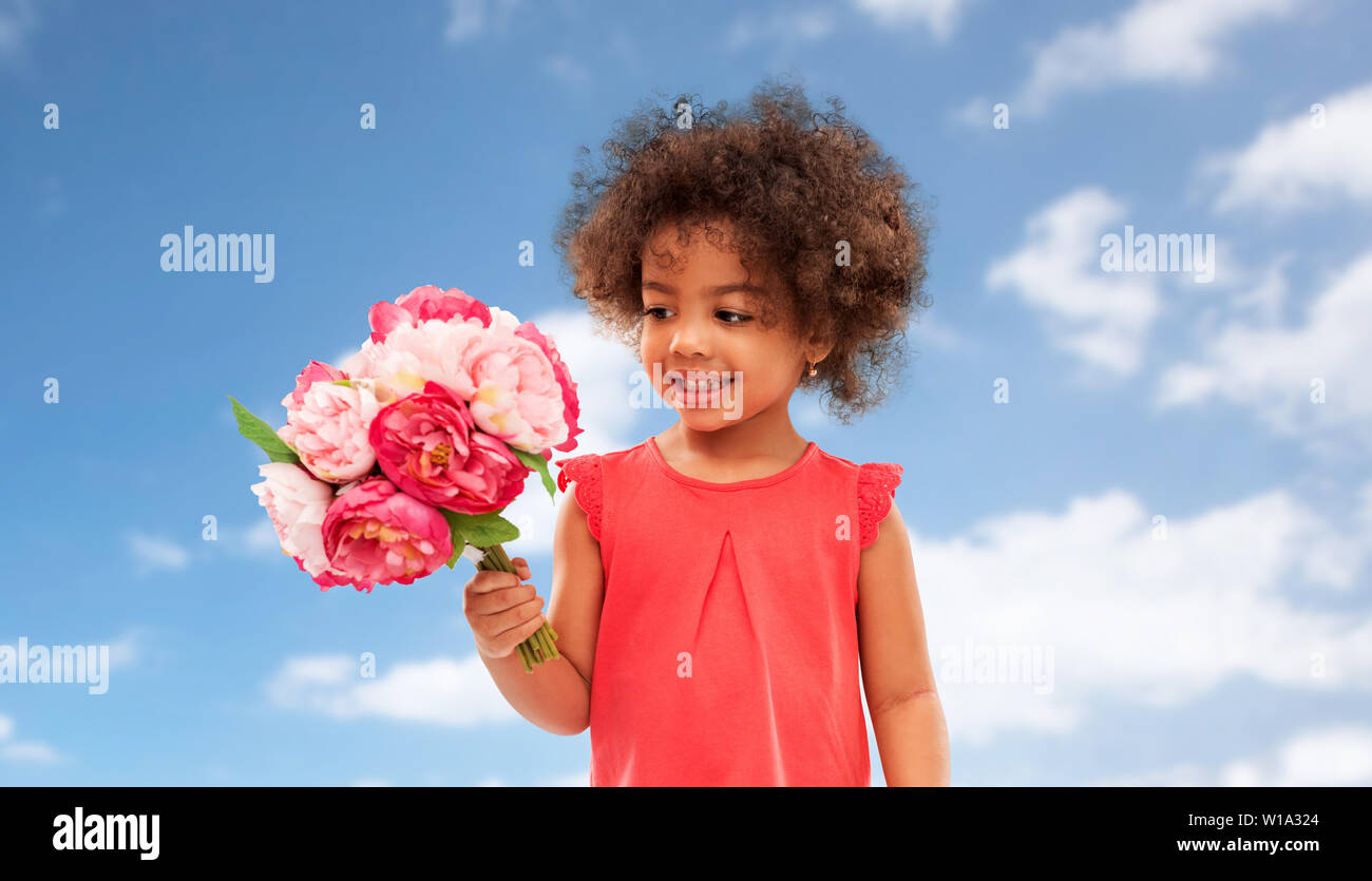 happy little african american girl with flowers Stock Photo - Alamy