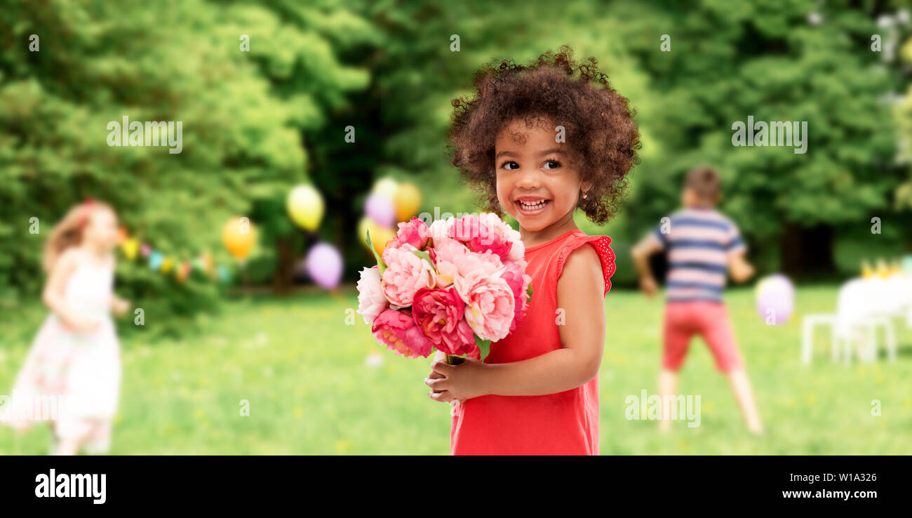happy little african american girl with flowers Stock Photo - Alamy