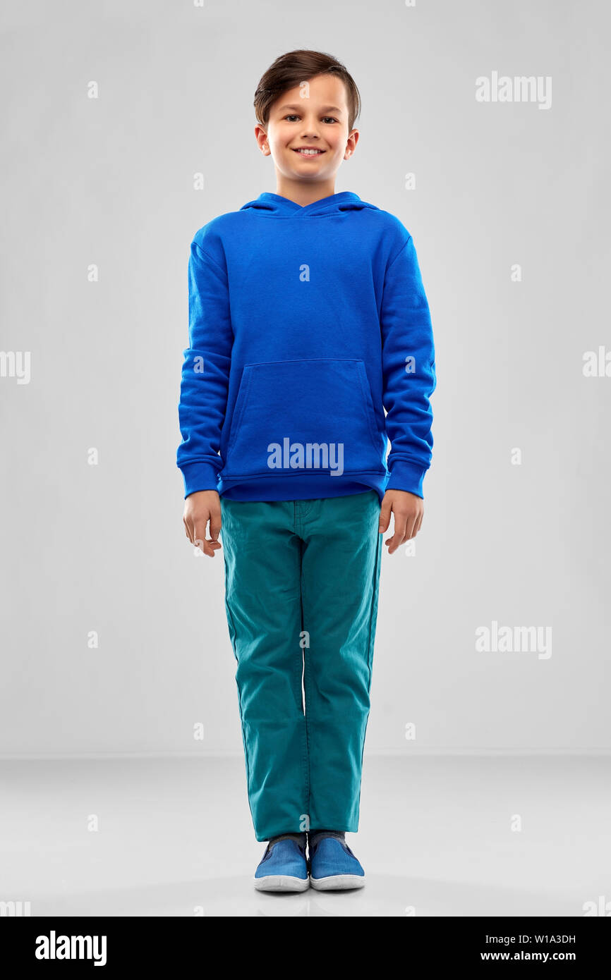 smiling boy in blue hoodie Stock Photo Alamy