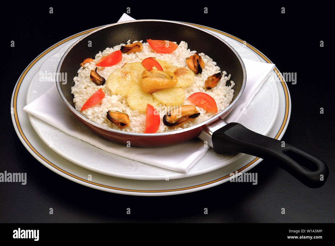 Italian Pan Rice Italian food recipes, pan of Rice Mussels and potatoes Stock Photo - Alamy
