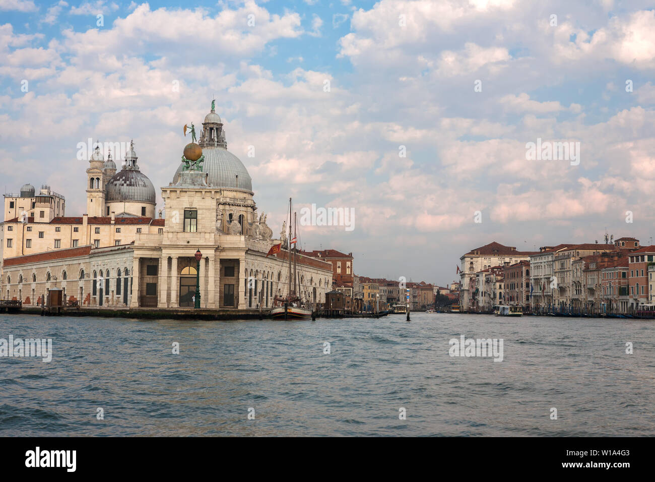 The entrance to the Canal Grande, the Punta della Dogana, and the Salute from the Bacino di San Marco, Venice, Italy Stock Photo