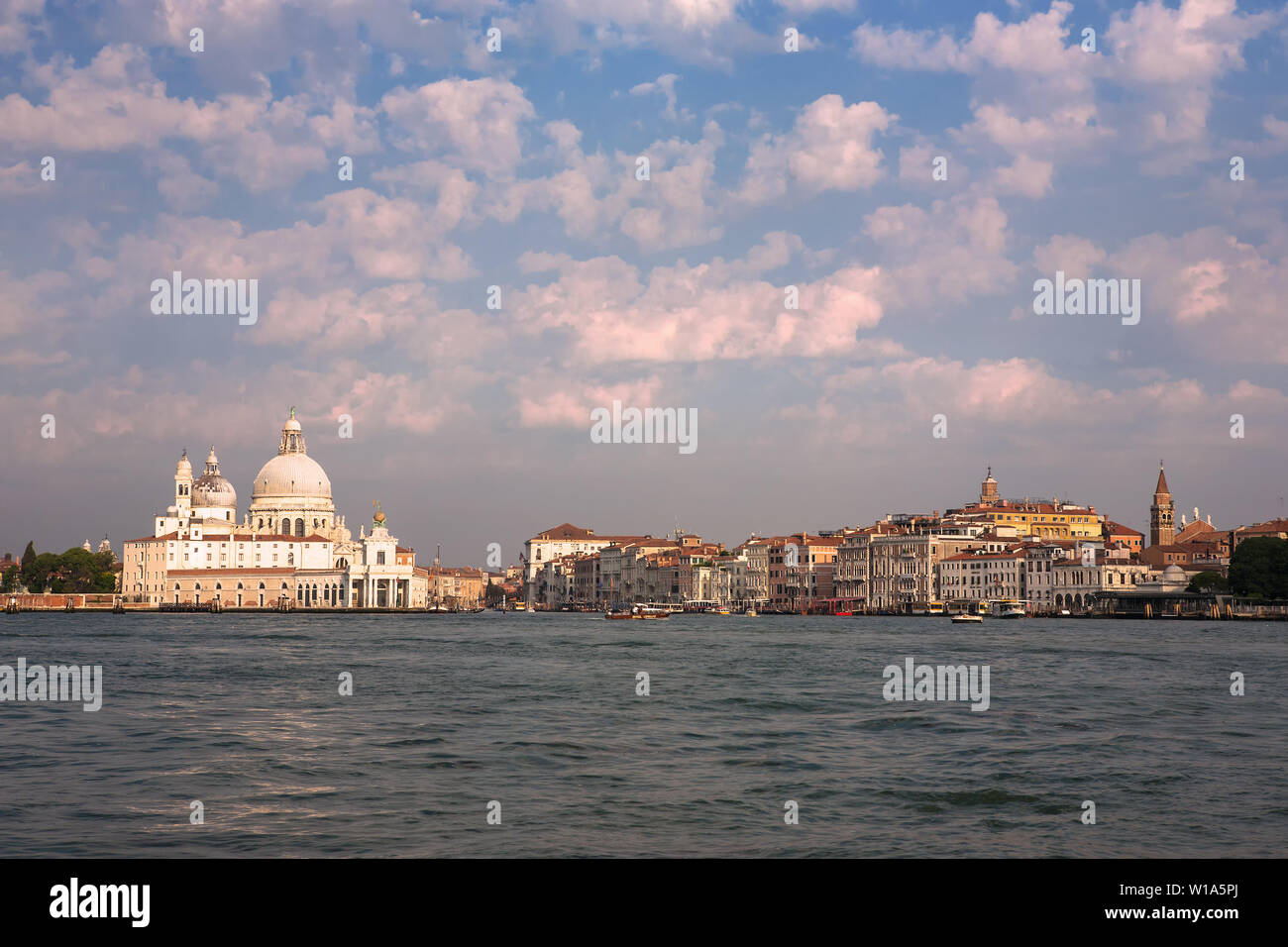 The entrance to the Canale Grande, the Punta della Dogana, and the Salute from the Bacino di San Marco, Venice, Italy Stock Photo