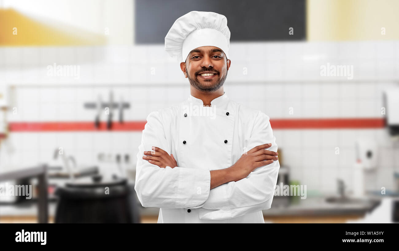 happy indian chef in toque at restaurant kitchen Stock Photo - Alamy