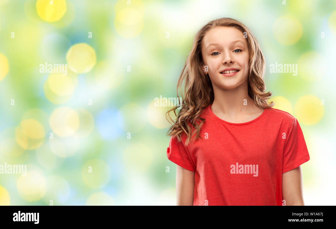 teenage girl in red t-shirt over green lights Stock Photo