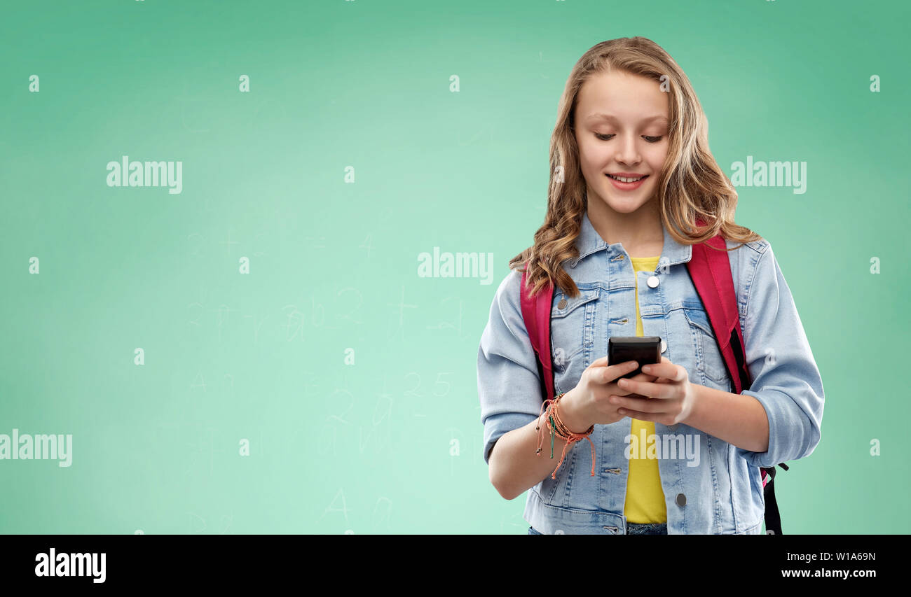 teen student girl with school bag and smartphone Stock Photo - Alamy