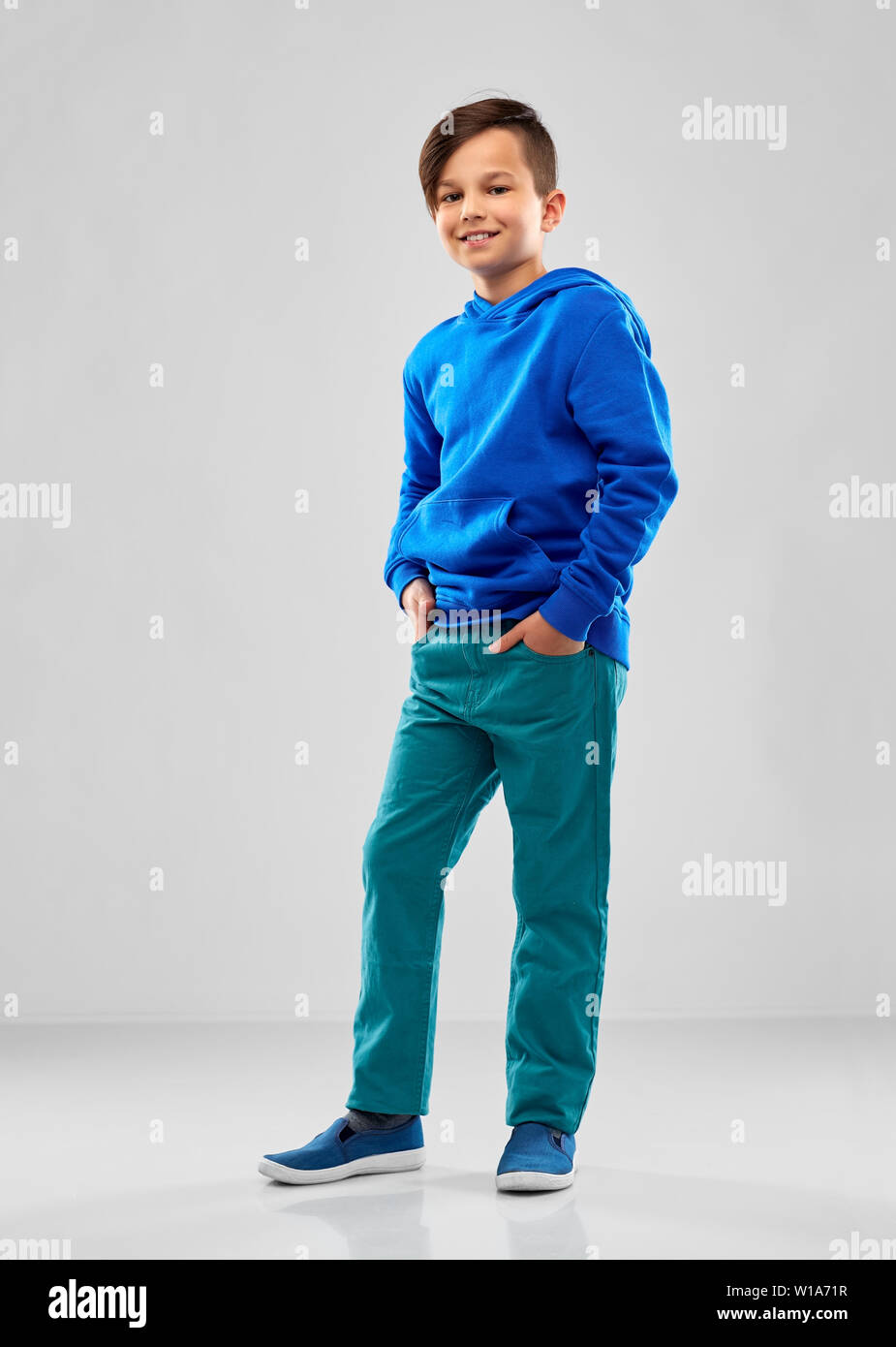 smiling boy in blue hoodie Stock Photo Alamy