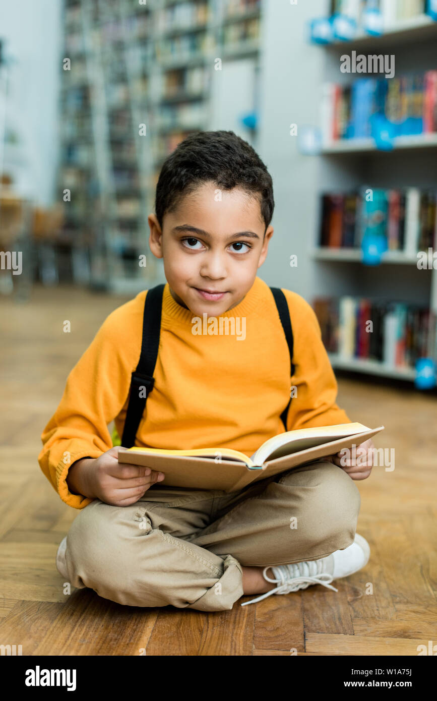 African boy sitting on floor hi-res stock photography and images - Alamy