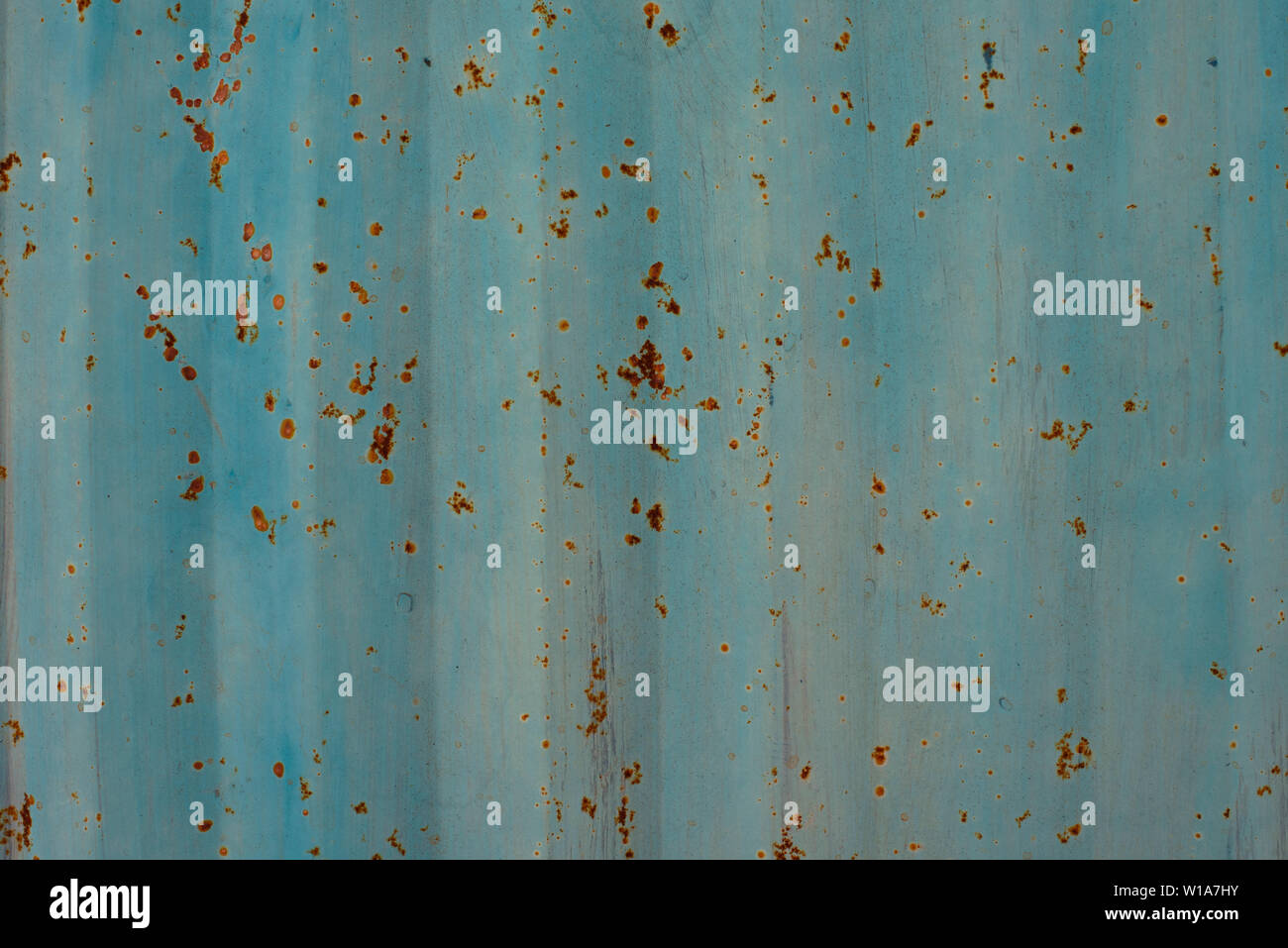 Light blue / duck egg painted metal wall texture background. Stripy grunge / grungy, corroding surface. Stock Photo