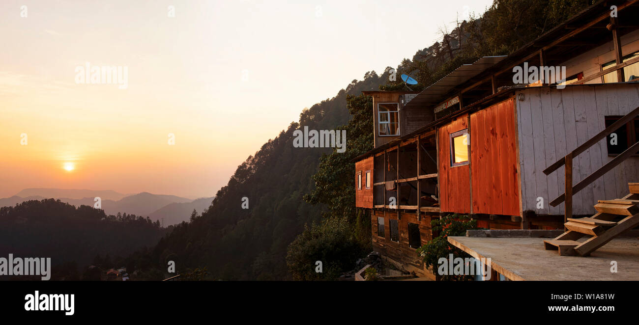 Panoramic views during sunset of wooden cabins in mountain settings. San José del Pacífico, Oaxaca, Mexico. May 2019 Stock Photo