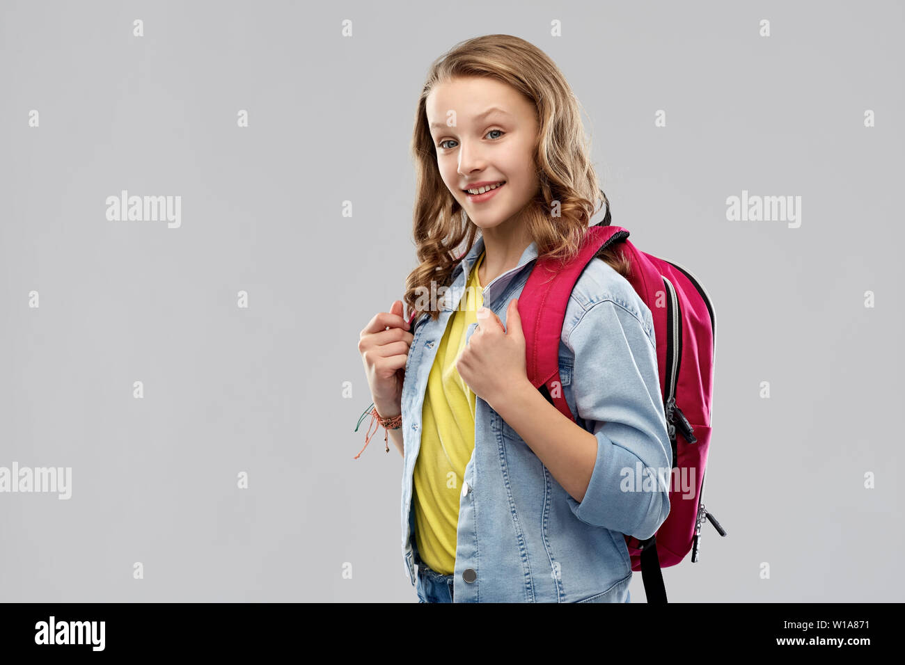 happy smiling teenage student girl with school bag Stock Photo - Alamy