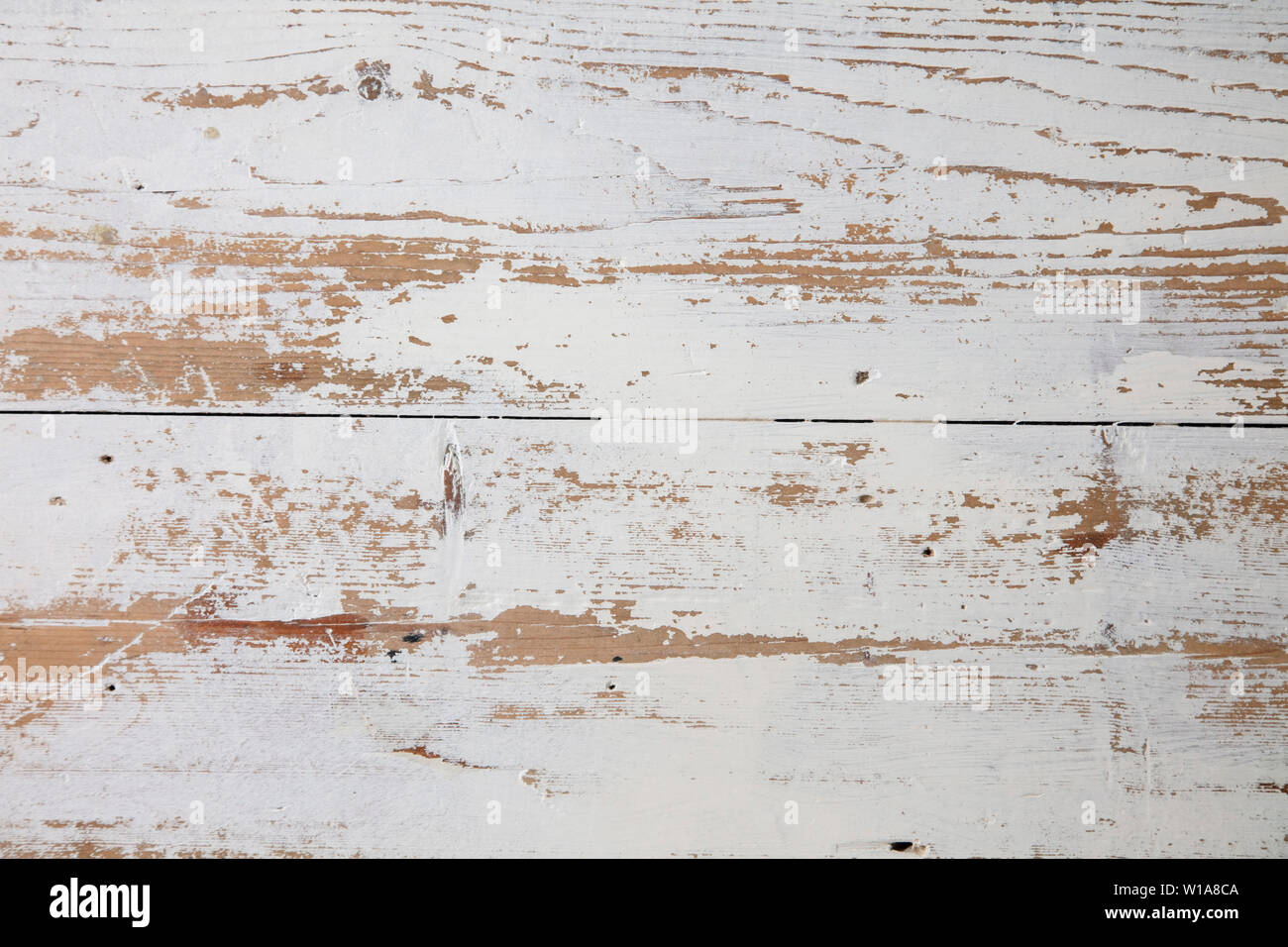 White wooden floorboards. Distressed worn floorboard background painted white Stock Photo