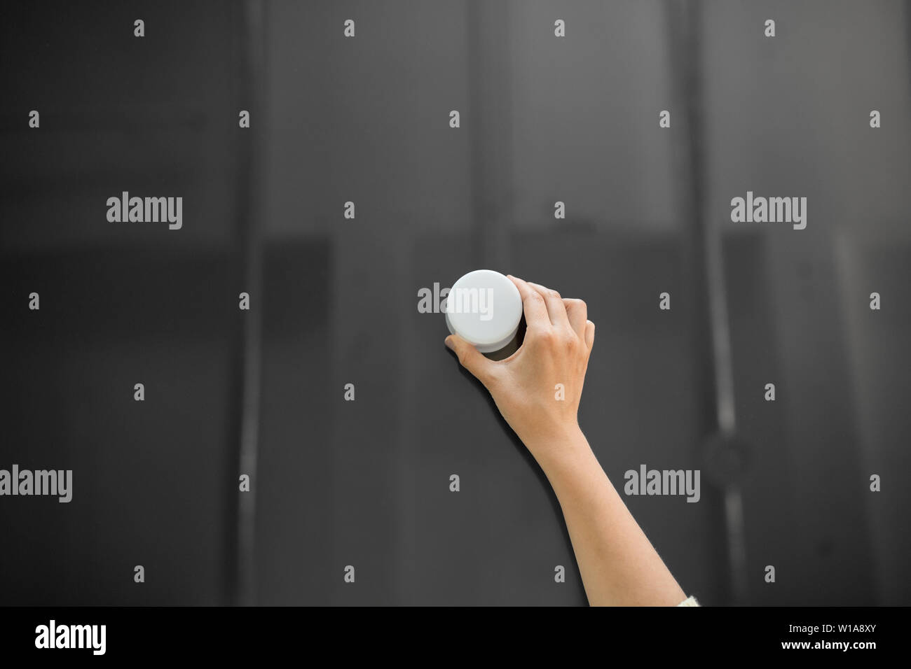hand using smart speaker on interactive panel Stock Photo