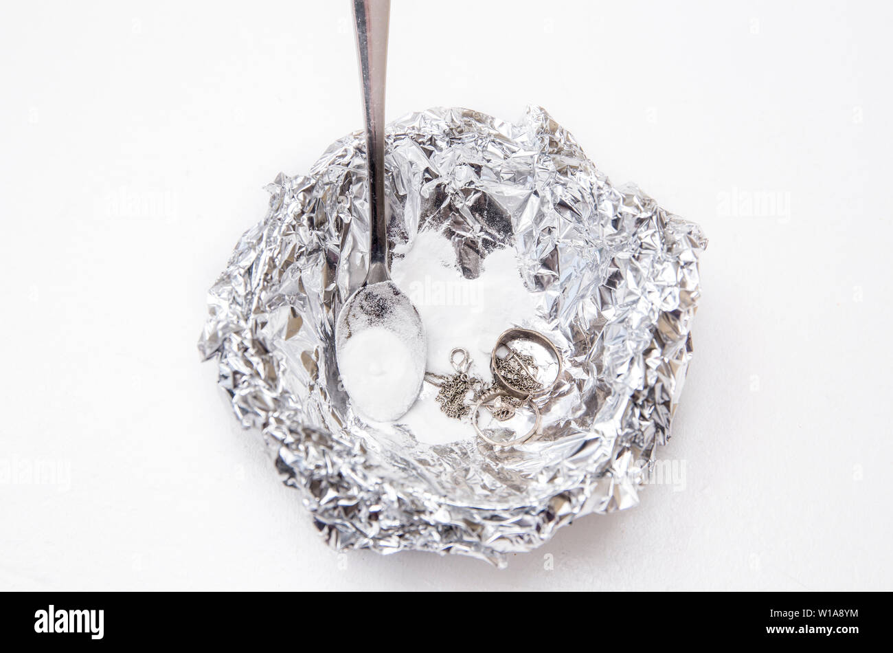 A solution of baking soda(Sodium bicarbonate) and warm water will