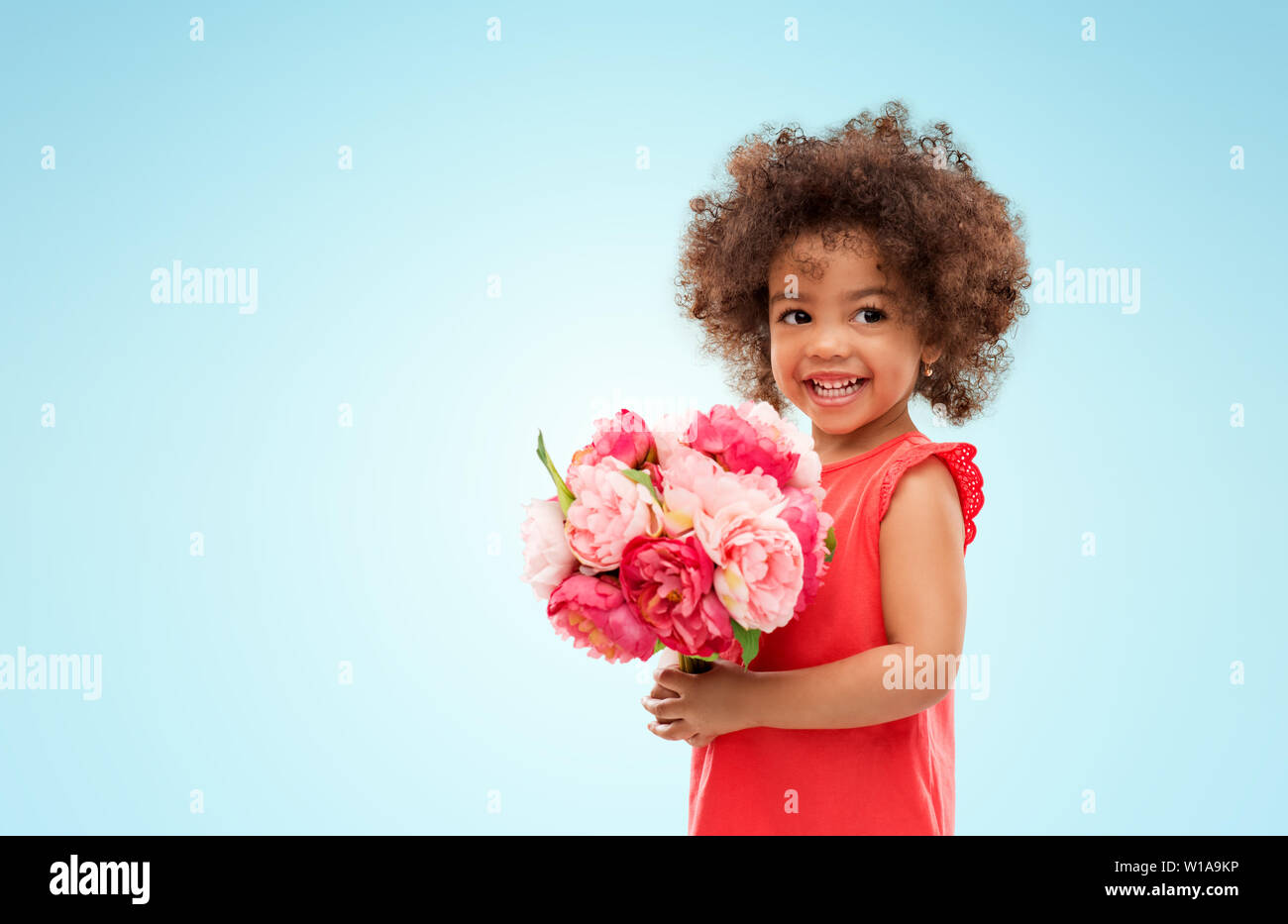 happy little african american girl with flowers Stock Photo - Alamy
