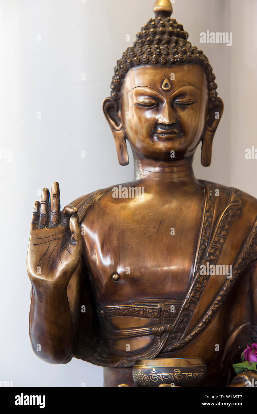 Hindu temple with a statue of Buddha on the altar Stock Photo Alamy