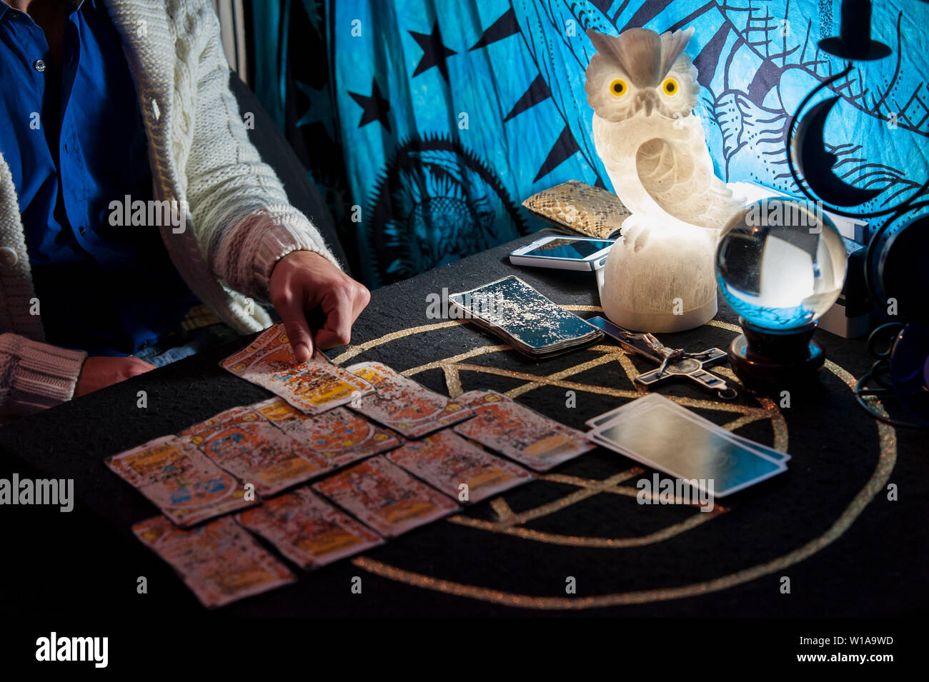The necromancer reads the cards and predicts the future Stock Photo