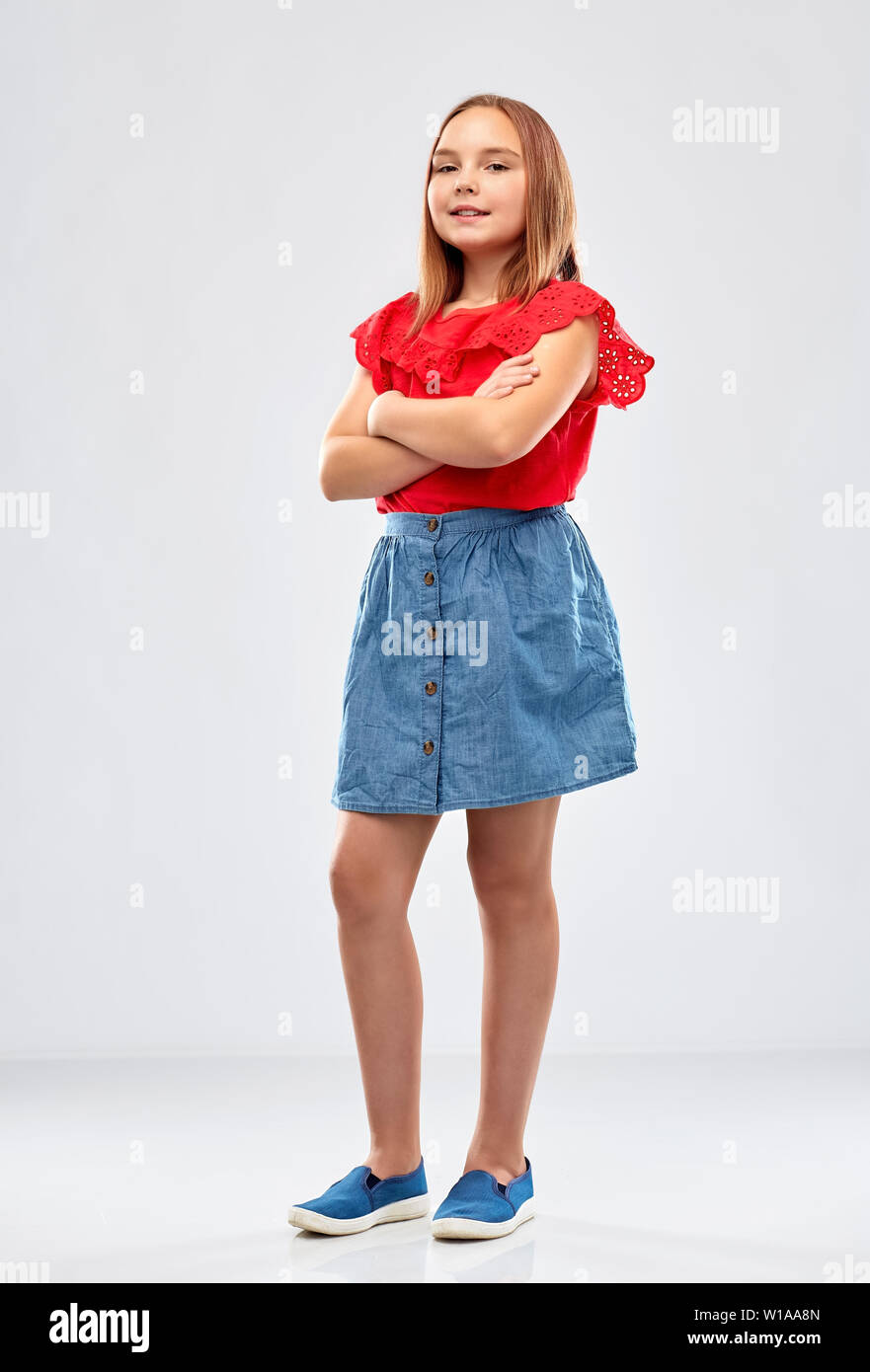 beautiful smiling girl with crossed arms Stock Photo - Alamy