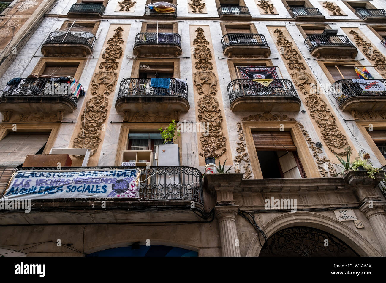 A Banner Hang Outside The Balcony Of Hospital Building Street 99