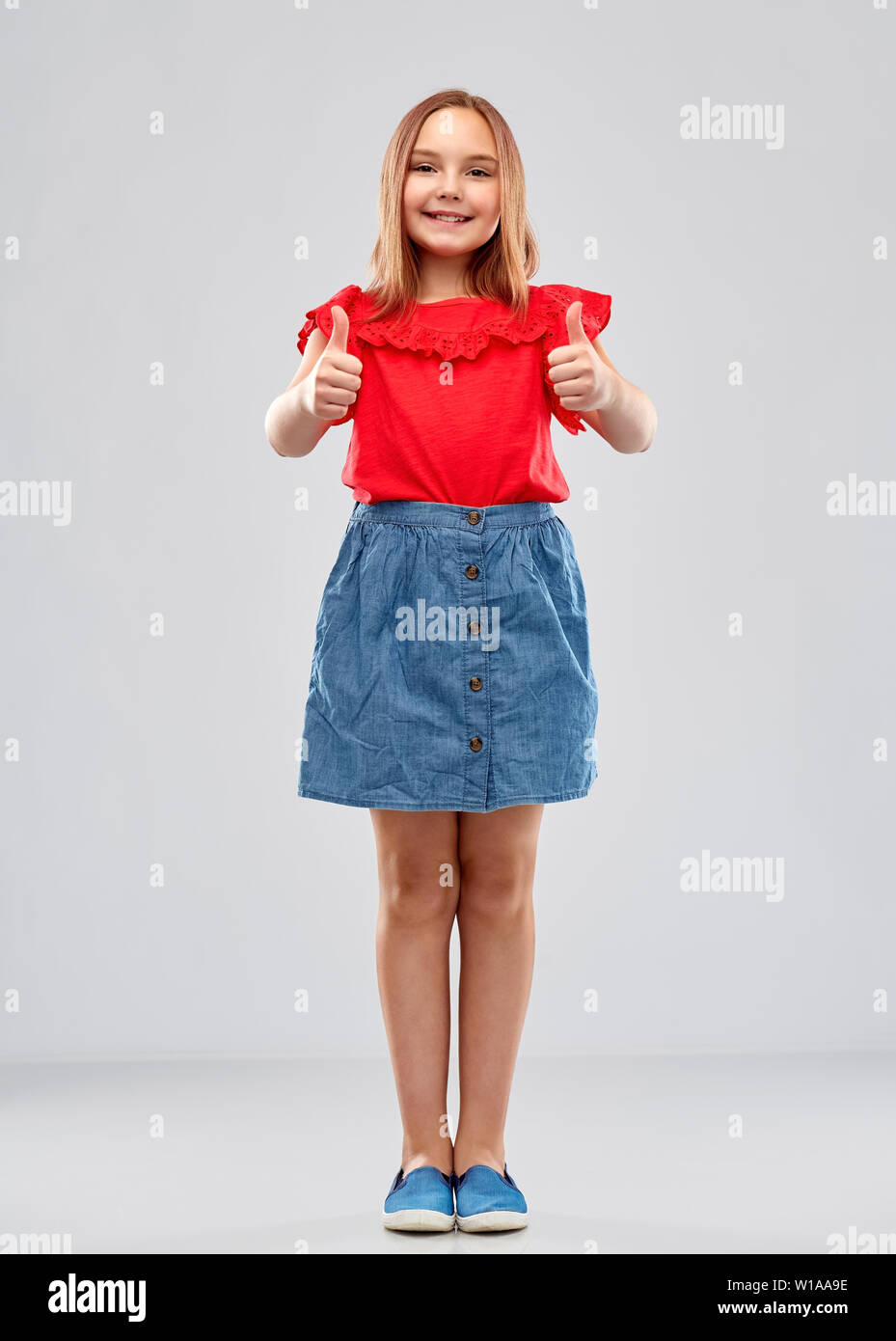 beautiful smiling girl showing thumbs up Stock Photo - Alamy