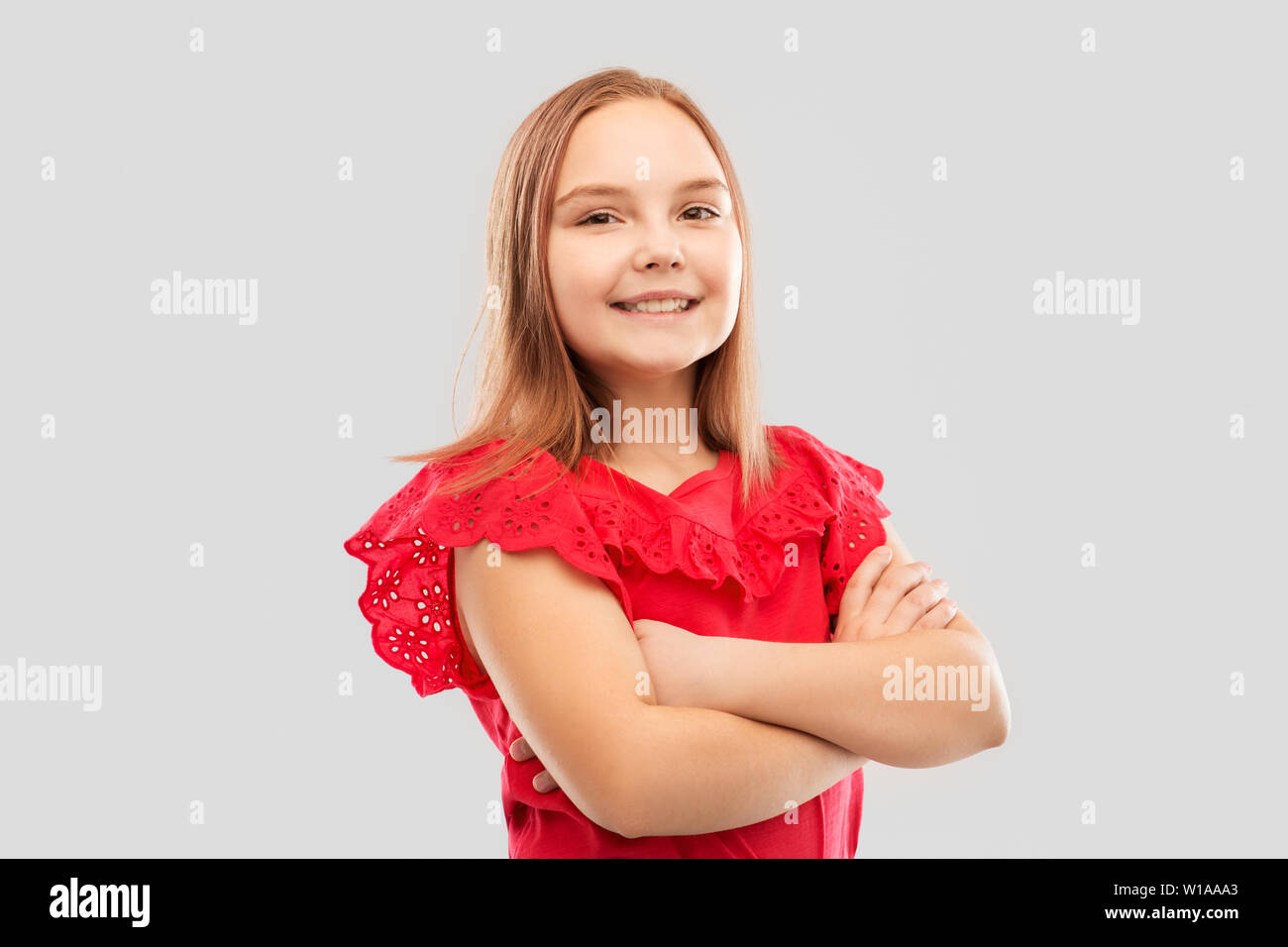 beautiful smiling girl with crossed arms Stock Photo - Alamy