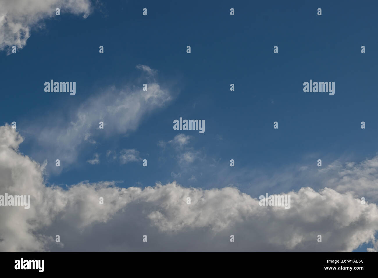 Evolution clouds over blue sky Stock Photo