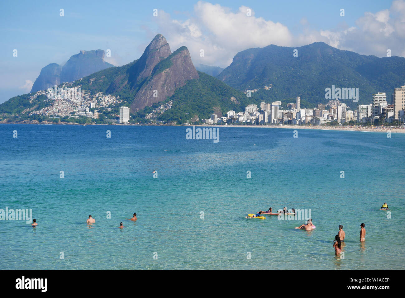 Rio de Janeiro, Brazil - May 5, 2019: landscape view of arpoador and ipanema beach with beach goers swimming Stock Photo