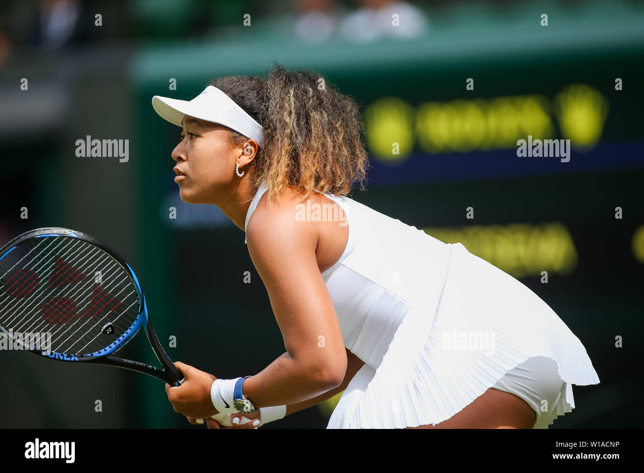 Naomi Osaka of Japan during the womens singles first round match of the Wimbledon Lawn Tennis Championships against Yulia Putintseva of Kazakhstan at the All England Lawn Tennis and Croquet Club in