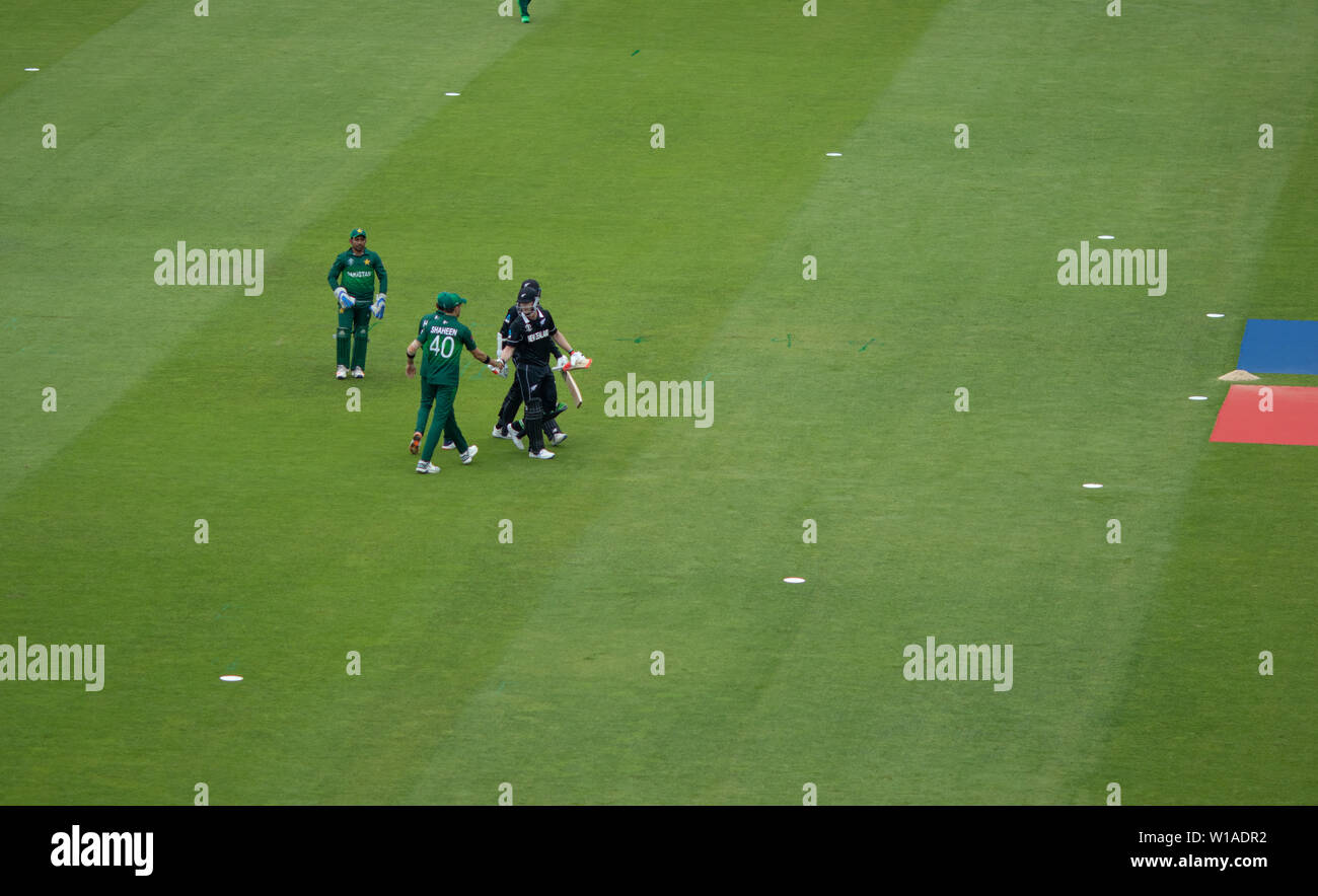 28th June 2019 - NZ batsman shake hands at the end of their in innings during their 2019 ICC Cricket World Cup game against Pakistan at Edgbaston, UK Stock Photo