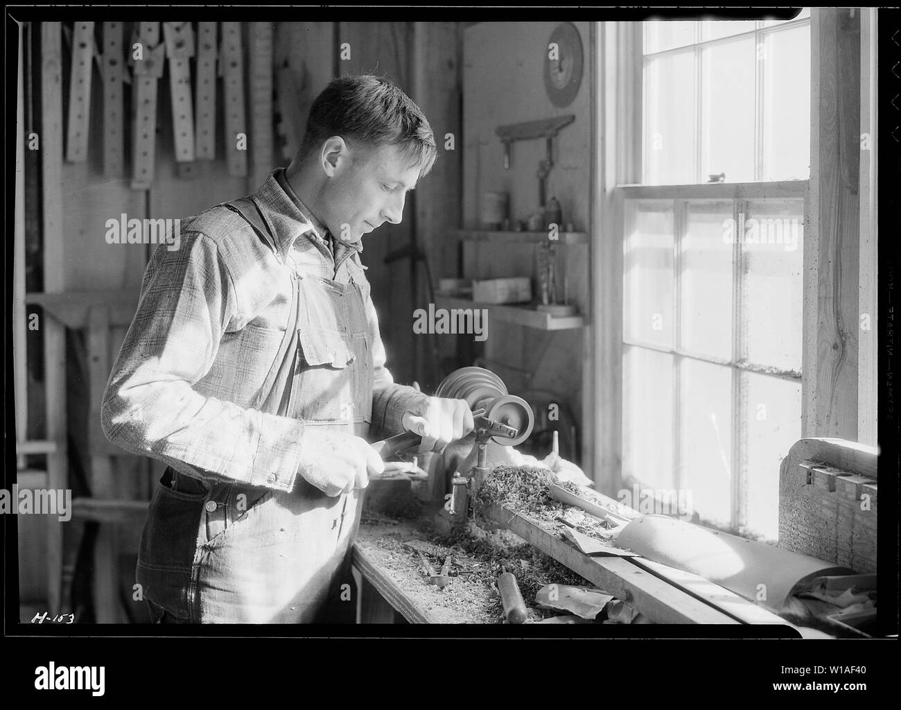 A closeup of one of the men in the shop of the Woodcrafters and
