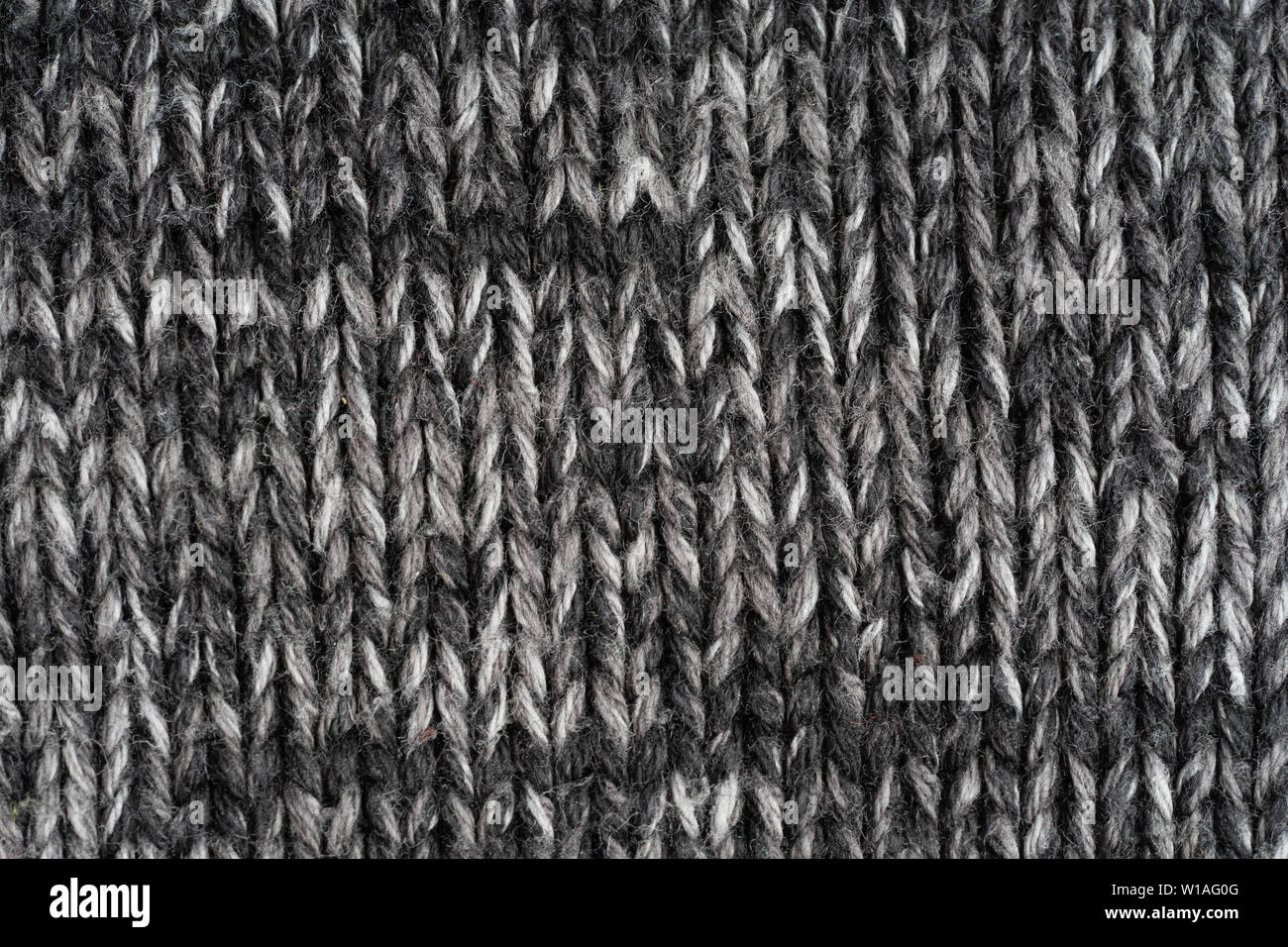 Texture knitted fabric. Warm sweater made of different color yarn. Creative vintage background Stock Photo