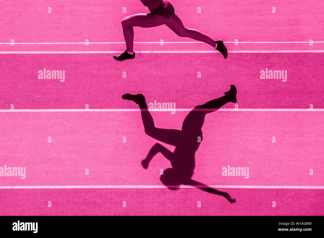 one caucasian woman runner jogger running in silhouette on stadium ...