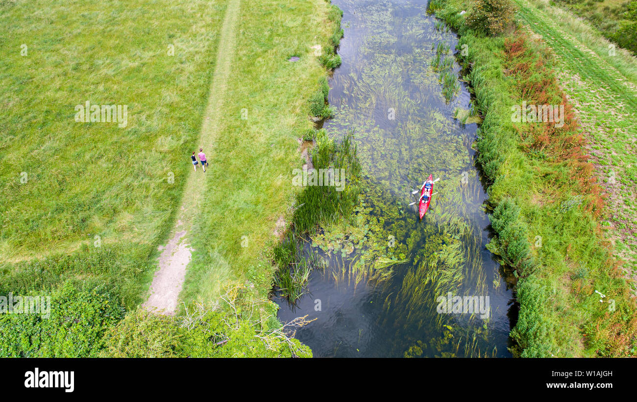 Aerial picture dated June 30th shows canoeists on the River Cam by Grantchester Meadows,Cambridgeshire, on Sunday afternoon and making the most of the good weather. Cooler weather is forecast for later in the week.  The Met Office forecast for today states rather cloudy across Scotland and Northern Ireland with some rain or heavy showers. Elsewhere, largely dry with sunny spells, although rather cloudy initially in the west. Feeling fresher for all, but still warm in any sunshine in the south.  Tonight:  Dry with clear spells overnight across the south and east. Rather cloudy elsewhere, with s Stock Photo