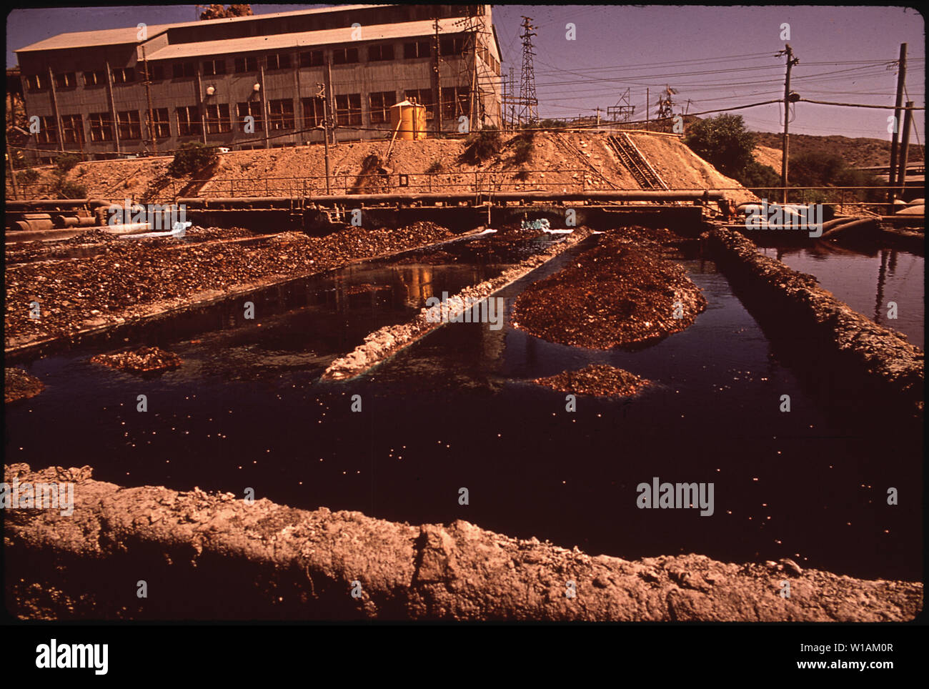 AREA OF COPPER SMELTING PLANT WHERE IRON IS LEACHED, OR SEPARATED OUT Stock Photo