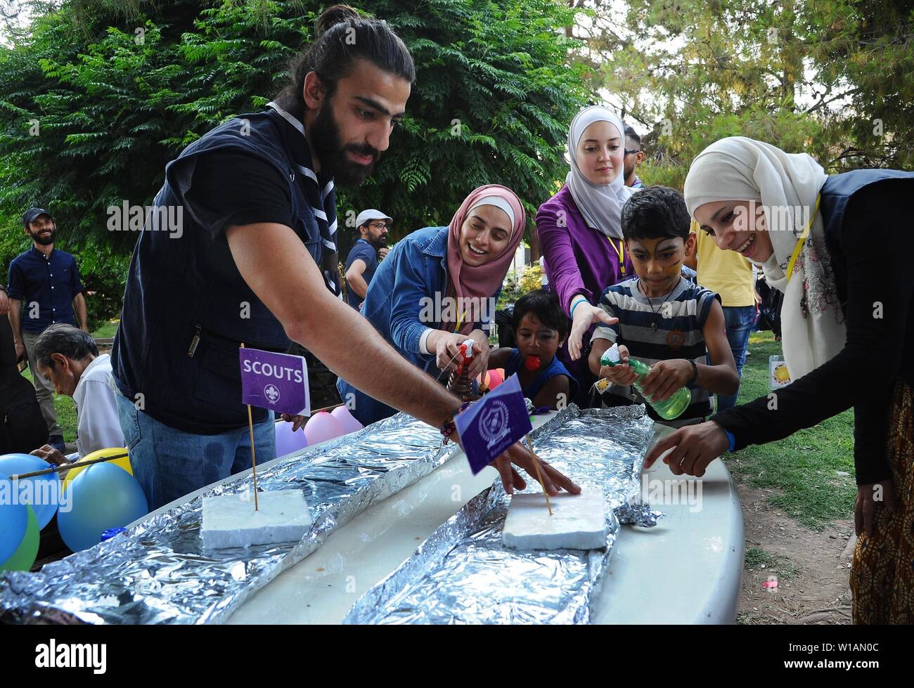 Damascus, Syria. 1st July, 2019. Homeless Syrian kids participate in activities organized by the Sayyar Initiative in Damascus, Syria, on July 1, 2019. The activities were held to make homeless Syrian kids feel loved and accepted in the society. Credit: Ammar Safarjalani/Xinhua/Alamy Live News Stock Photo