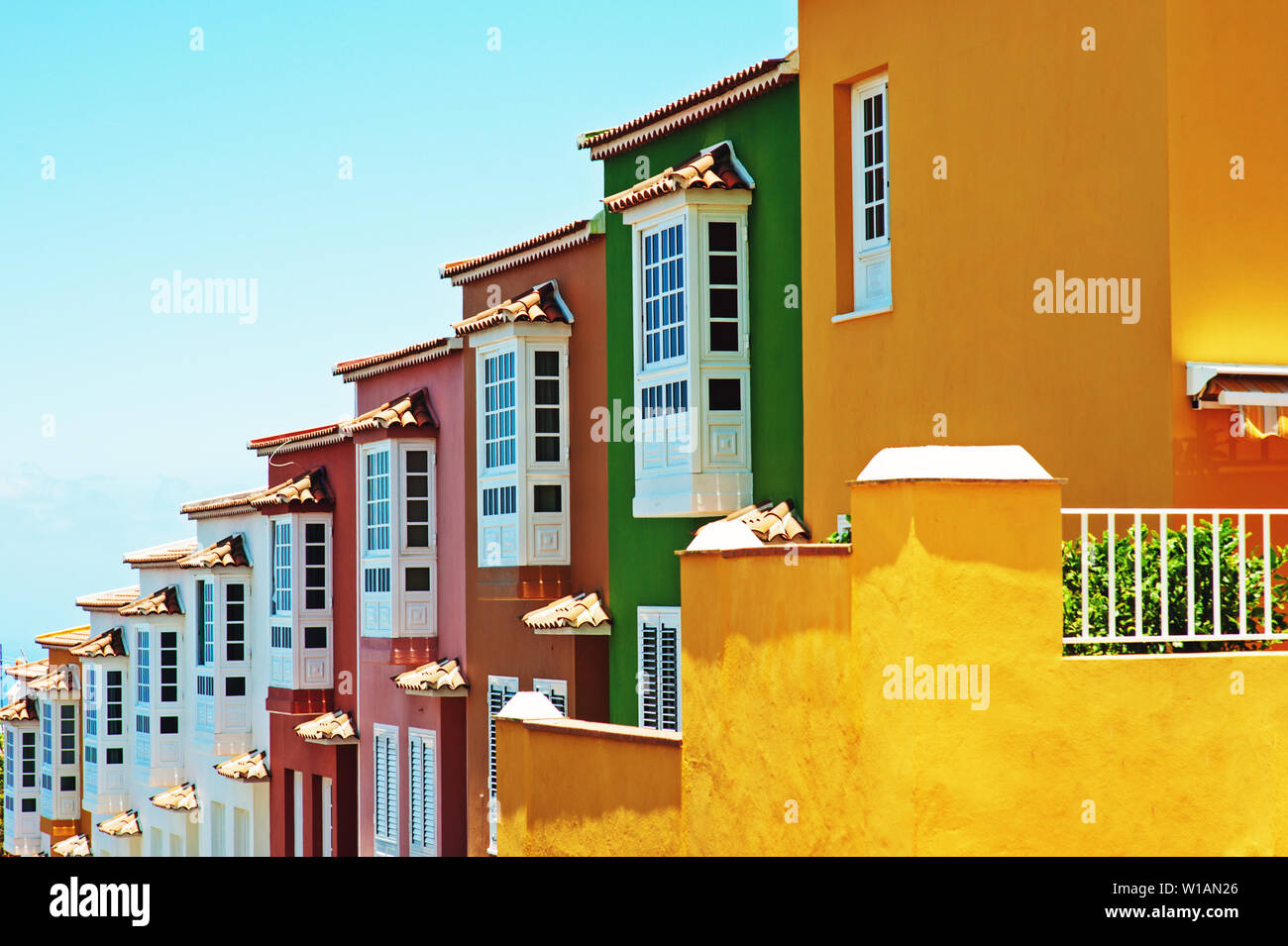 Row of colourful houses and clear blue sky on Tenerife, Canary Islands, Spain. Stock Photo