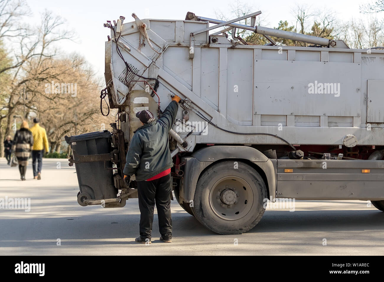 Varna, Bulgaria, February 28, 2019. The garbage truck operator controls