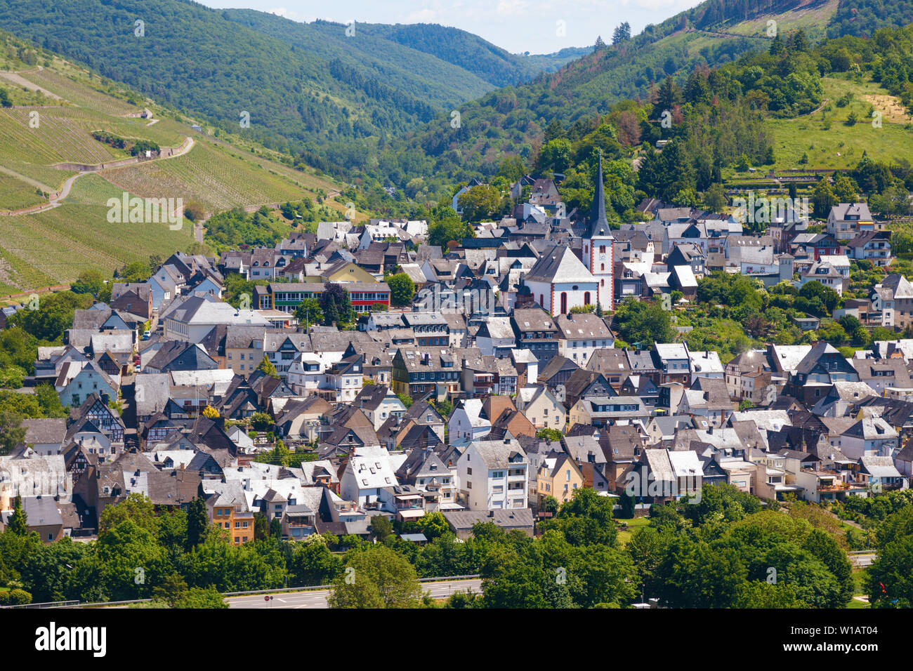 Aerial view of the village and Enkirch and the surrounding vineyards of the Moselle valley on a sunny afternoon. Rhineland-Palatinate, Germany. Stock Photo