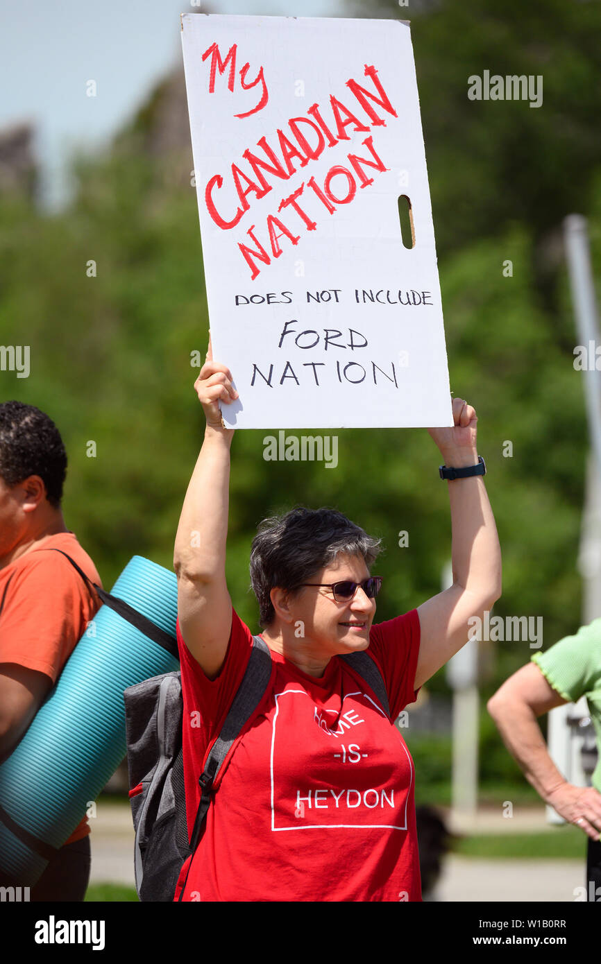 A demonstrator shows distaste for premier Doug Ford at a Canada Day event held by a Liberal politician after he cancelled the original festivities. Stock Photo